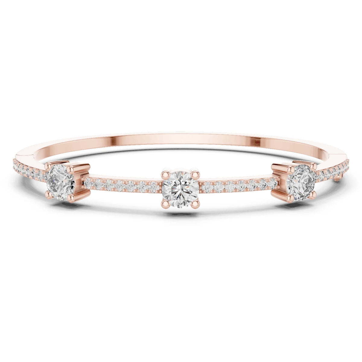 A delicate rose gold band ring featuring three round-cut center moissanite stones and pavé-set side stones, shown on a clean white background.