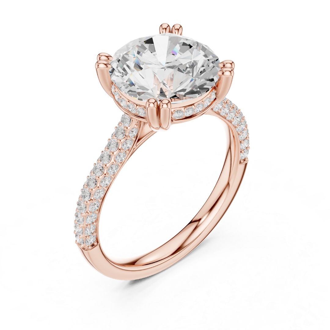 Rose gold ring with a large moissanite diamond and smaller diamonds on the band against a white background