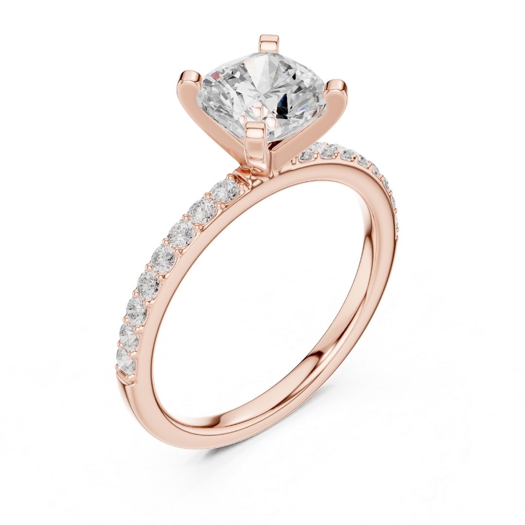 Rose gold ring with a large moissanite diamond and smaller diamonds on the band against a white background