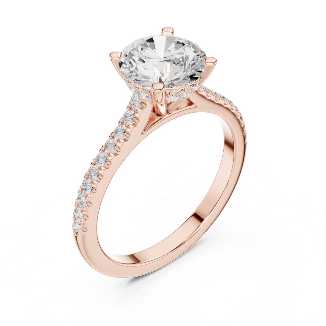 Rose gold ring with a large moissanite diamond and smaller diamonds on the band against a white background