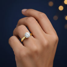 Load image into Gallery viewer, Gold ring with a 1ct moissanite diamond on a hand against a dark background