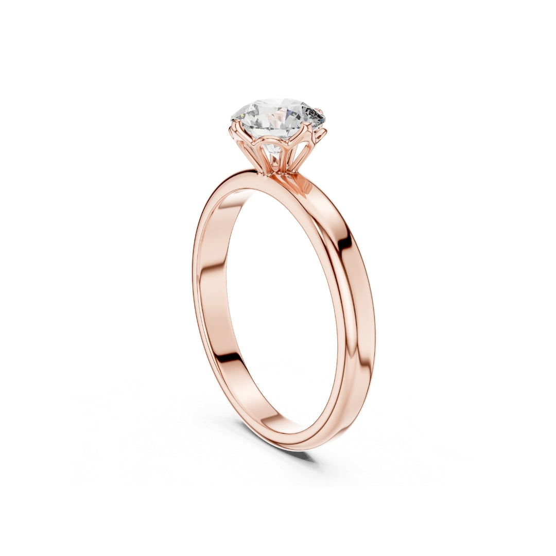 Rose gold ring with a 1ct moissanite diamond on a white background