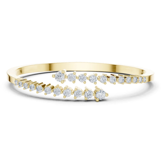 Gold bracelet with moissanite diamond accents on a white background