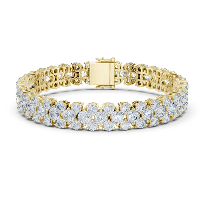 Gold bracelet with moissanite diamond accents on a white background