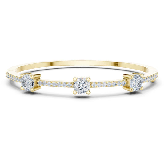 Gold bracelet with moissanite diamond accents on a white background