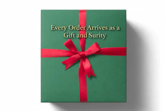 A green gift box with a red ribbon bow on top.