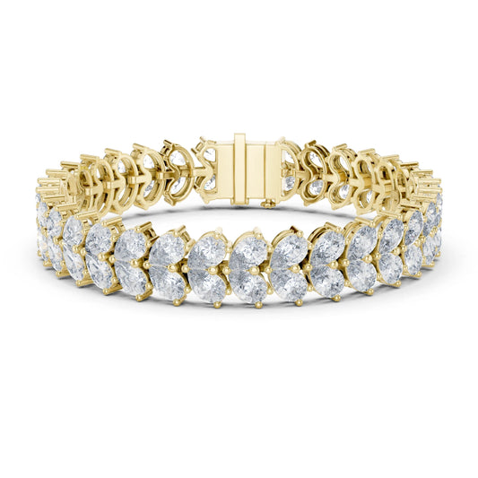 Gold bracelet with moissanite diamond accents on a white background