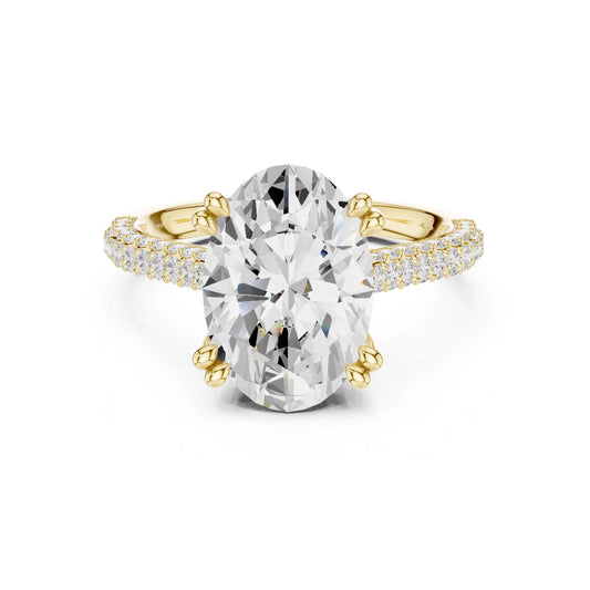 Gold and moissanite diamond ring with a large central gemstone on a white background