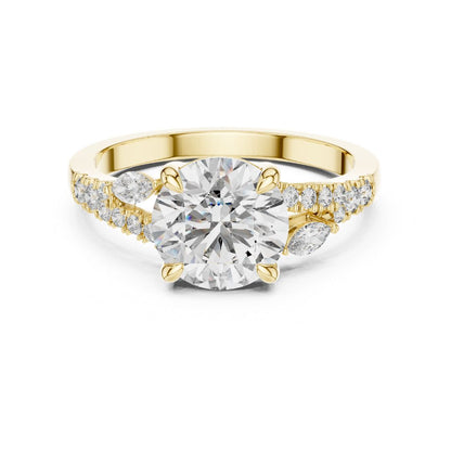 Gold and moissanite diamond ring on a white background
