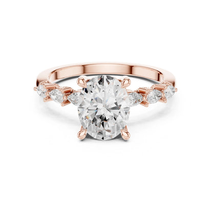 Rose gold ring with a large moissanite  diamond and smaller diamonds on the band against a white background