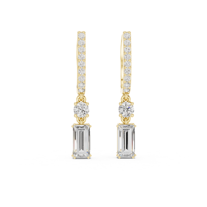 Gold and silver drop moissanite earrings with clear gemstones on a white background