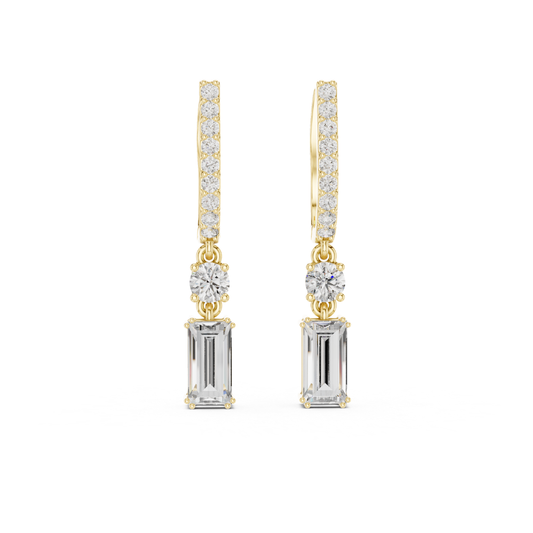 Gold and silver drop moissanite earrings with clear gemstones on a white background