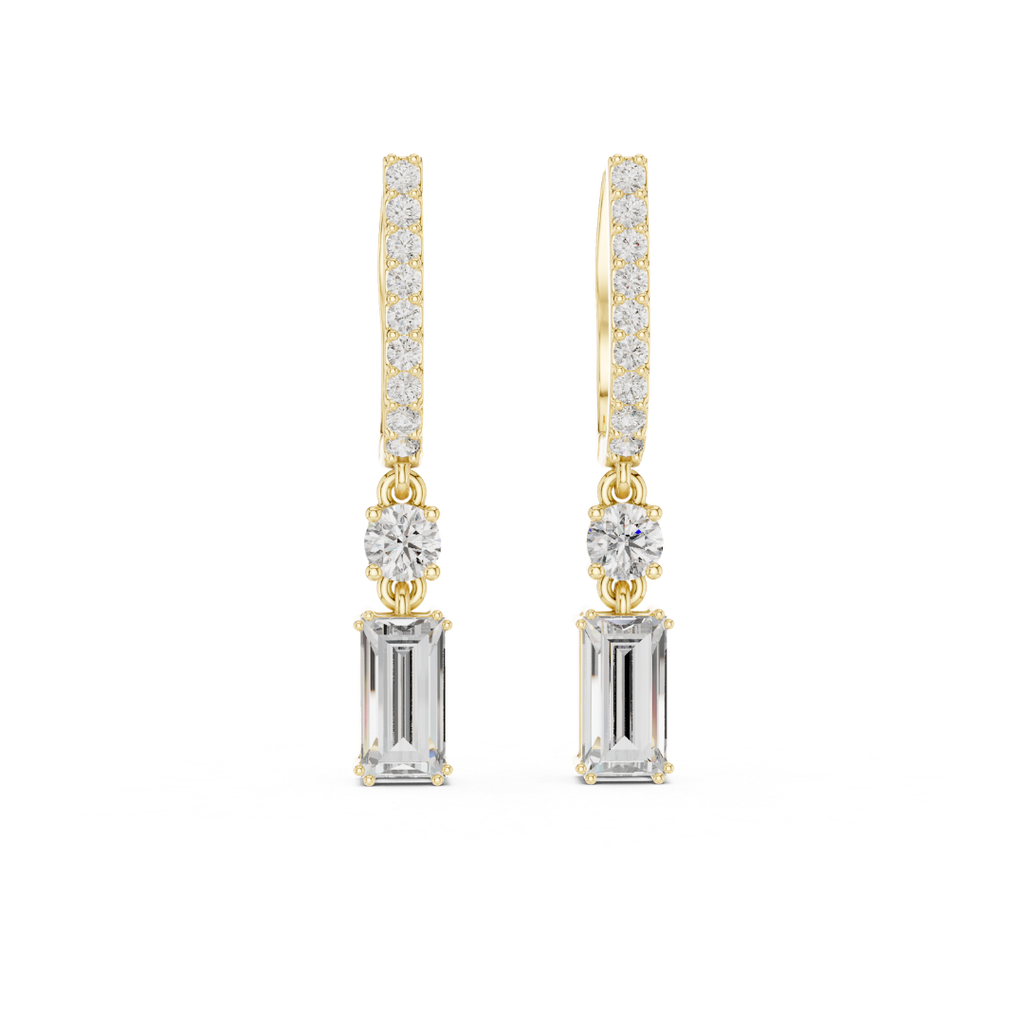 Gold and silver drop moissanite earrings with clear gemstones on a white background
