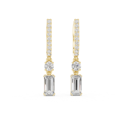 Gold and silver drop moissanite earrings with clear gemstones on a white background