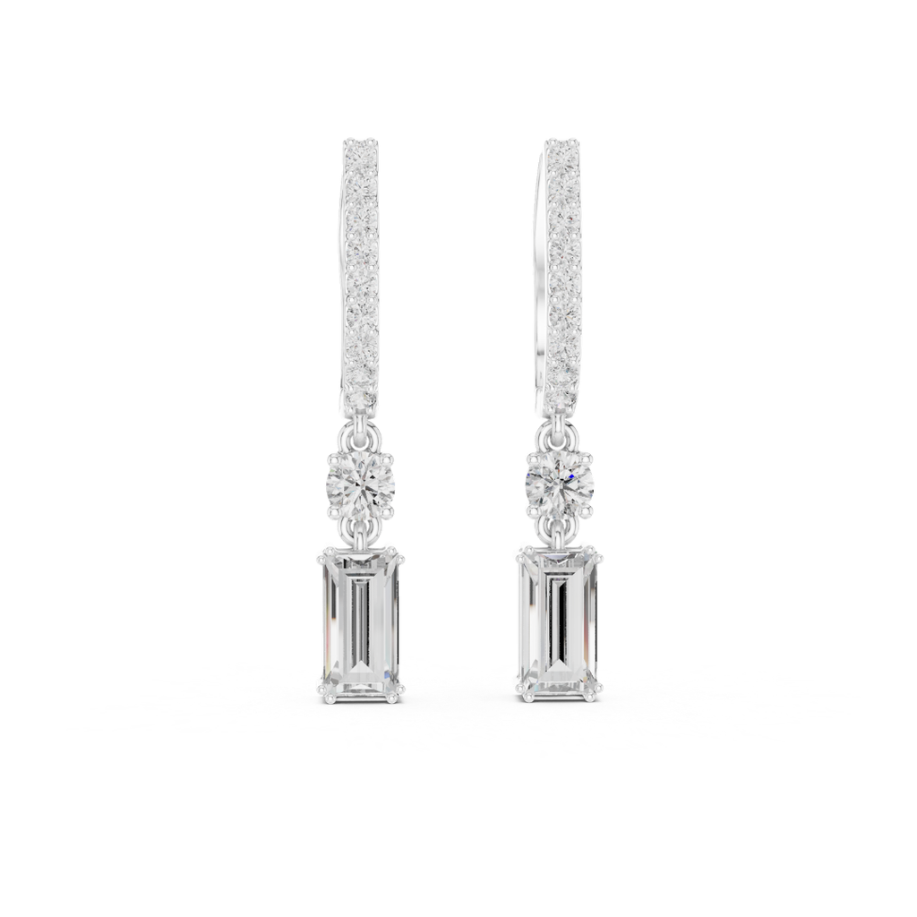 Pair of moissanite diamond earrings on a white background