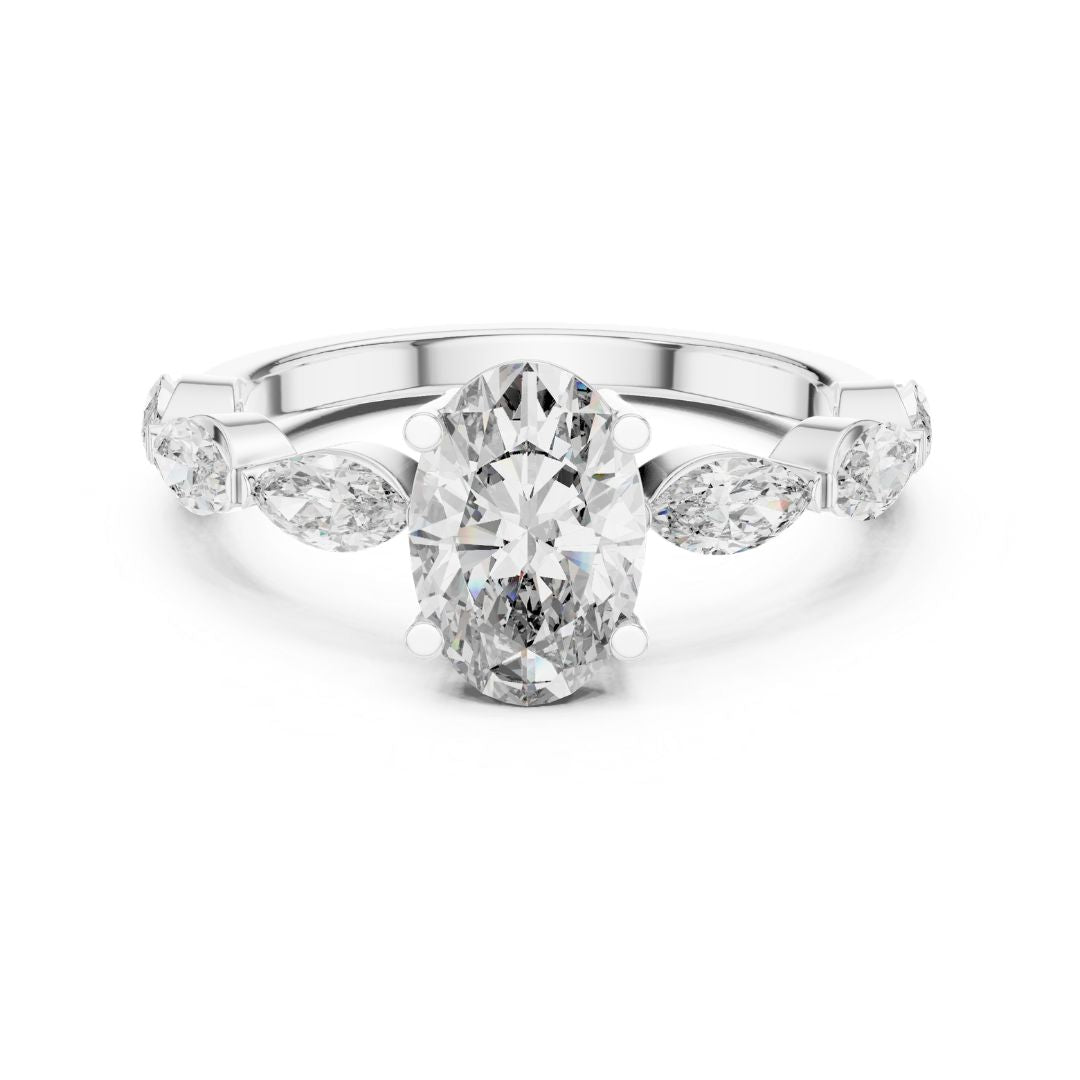 Diamond ring with a central oval-cut moissanite diamond and pear-shaped side stones on a white background