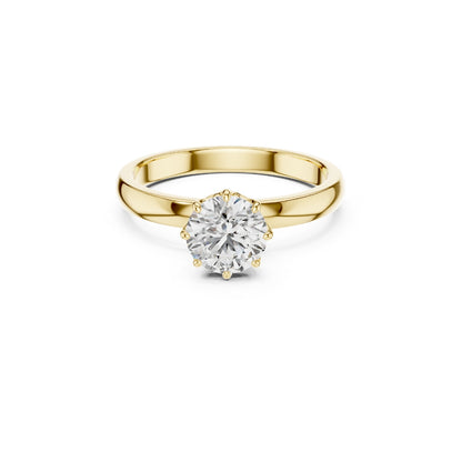 Gold ring with a 1ct moissanite diamond on a white background