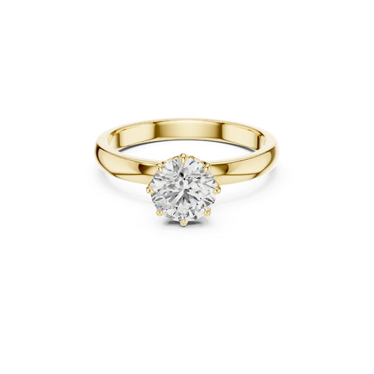 Gold ring with a 1ct moissanite diamond on a white background