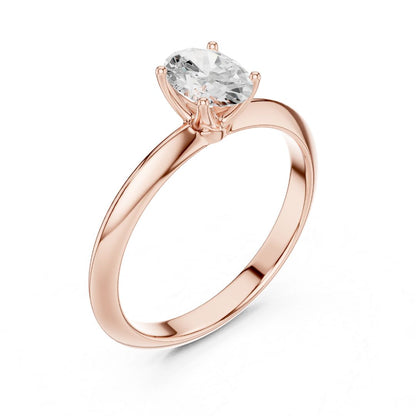 Rose gold ring with a moissanite diamond on a white background