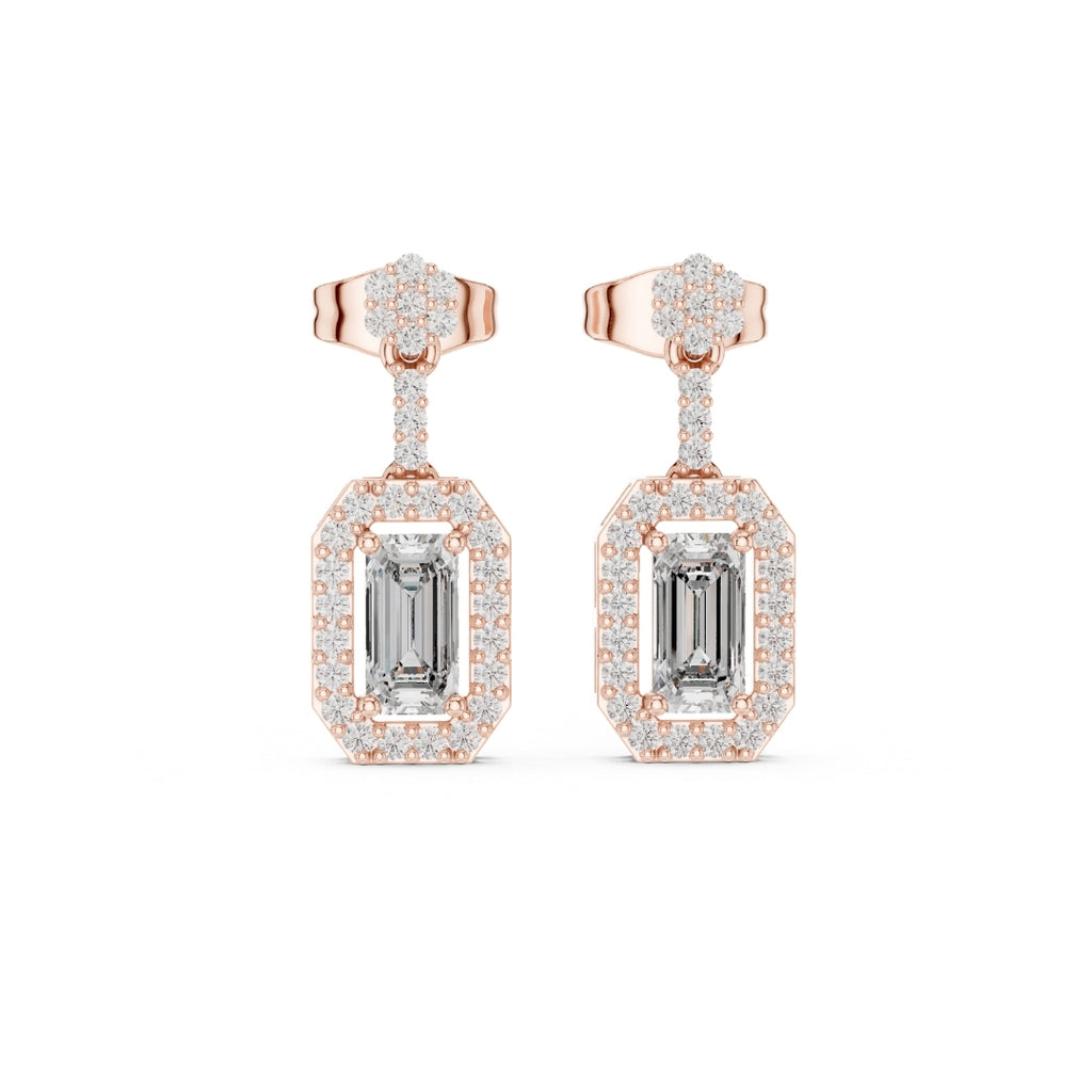 Rose gold earrings with emerald-cut moissanite gemstones on a white background