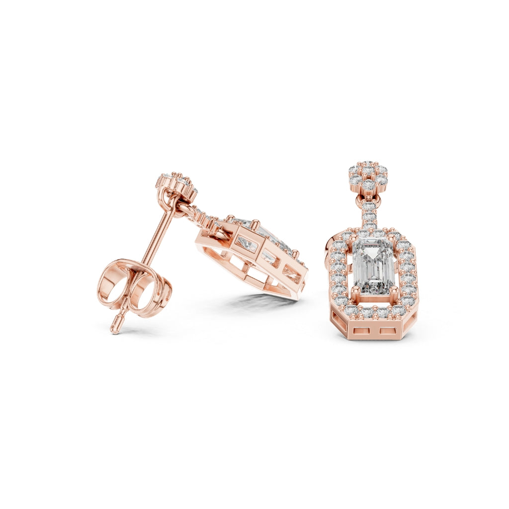 Rose gold earrings with moissanite diamond accents on a white background