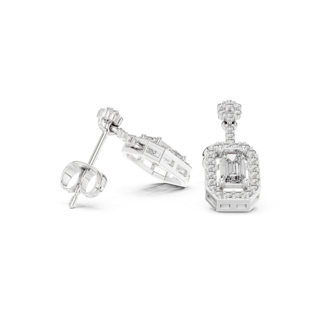 Pair of moissanite  diamond earrings on a white background