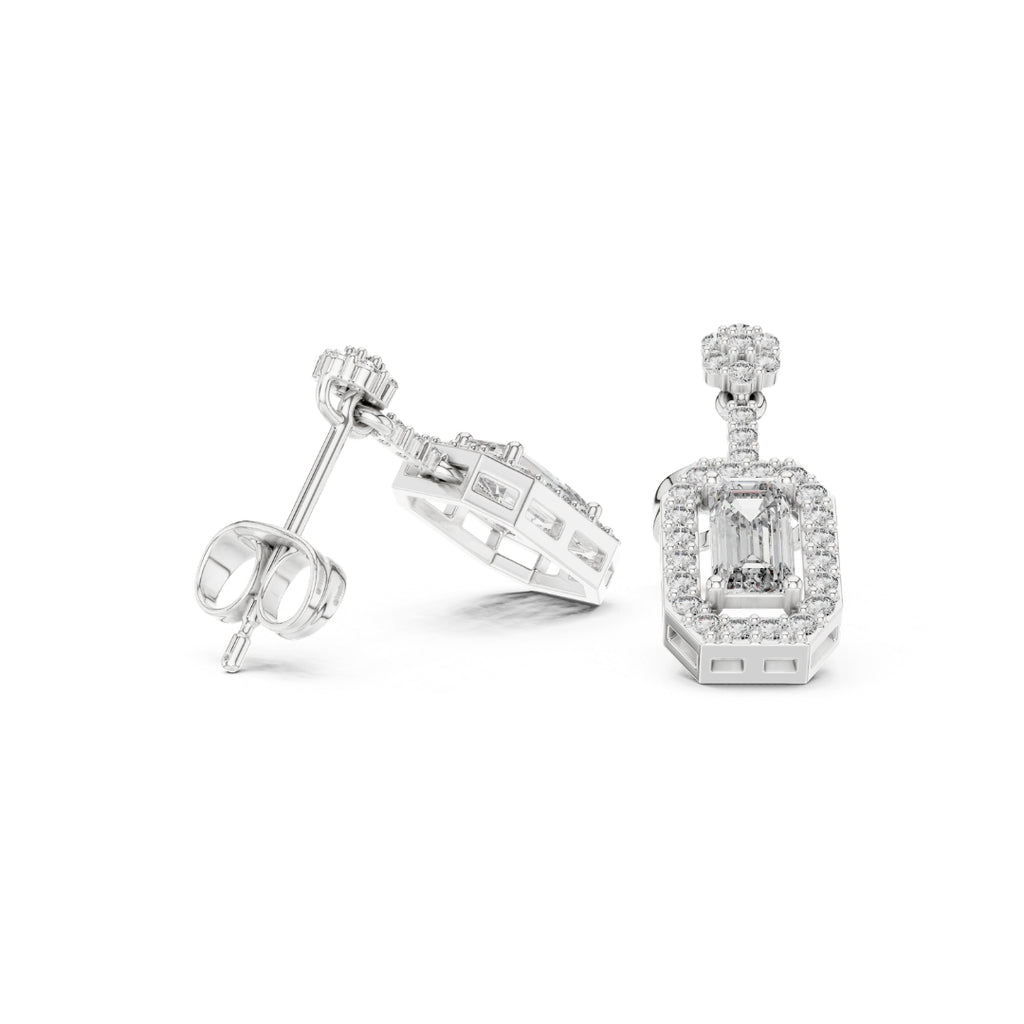 Pair of moissanite  diamond earrings on a white background