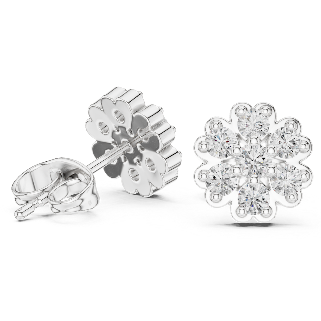 Silver snowflake moissanite diamond earrings on a white background