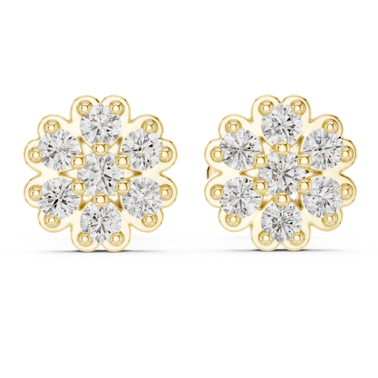 Gold earrings with clear moissanite gemstones on a white background