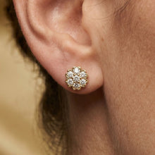 Load image into Gallery viewer, Close-up of a gold and moissanite diamond earring on an ear.