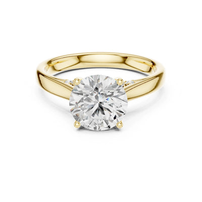 Gold ring with a large moissanite diamond on a white background