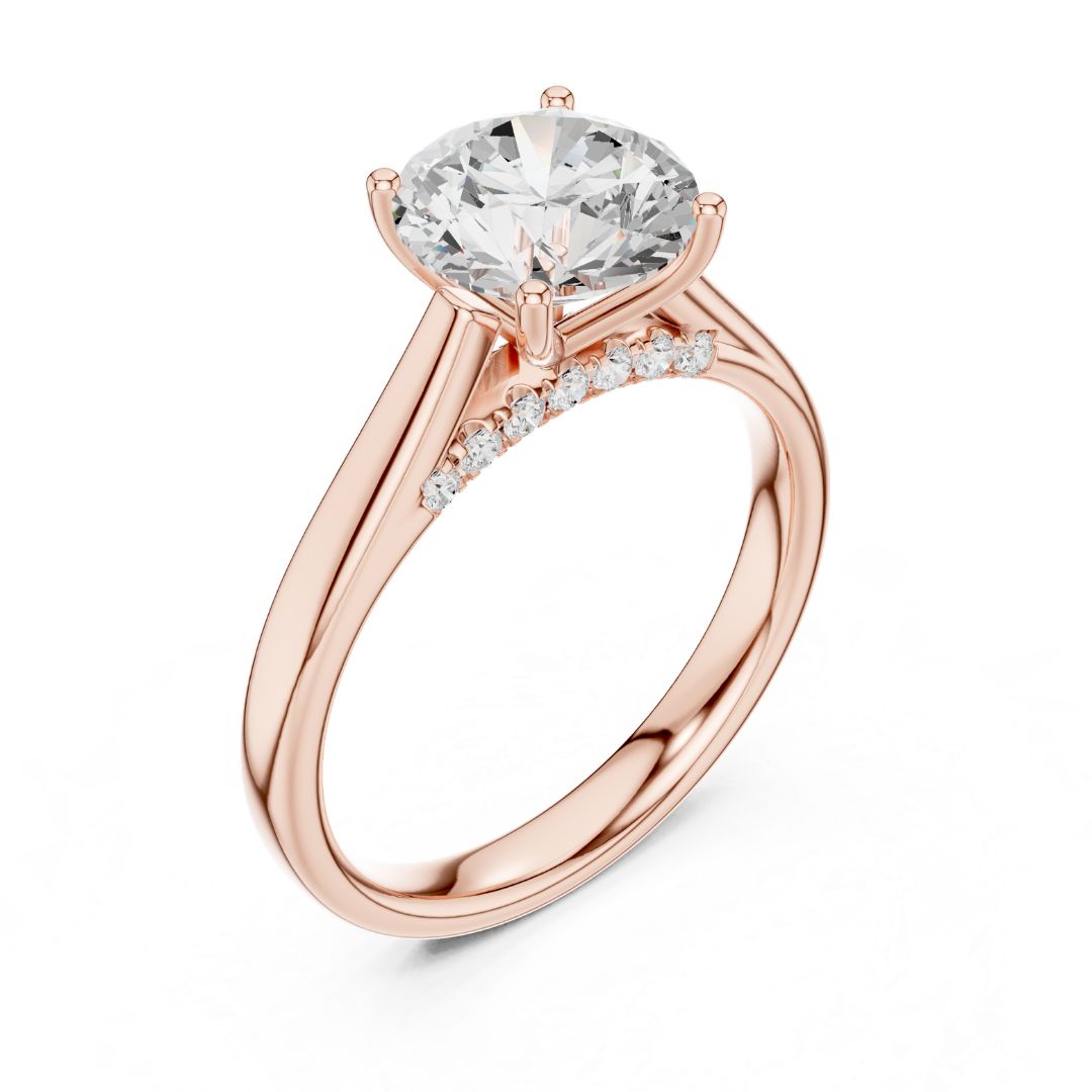 Rose gold ring with a large moissanite diamond and smaller diamonds on the band against a white background