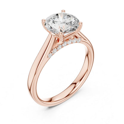 Rose gold ring with a large moissanite diamond and smaller diamonds on the band against a white background