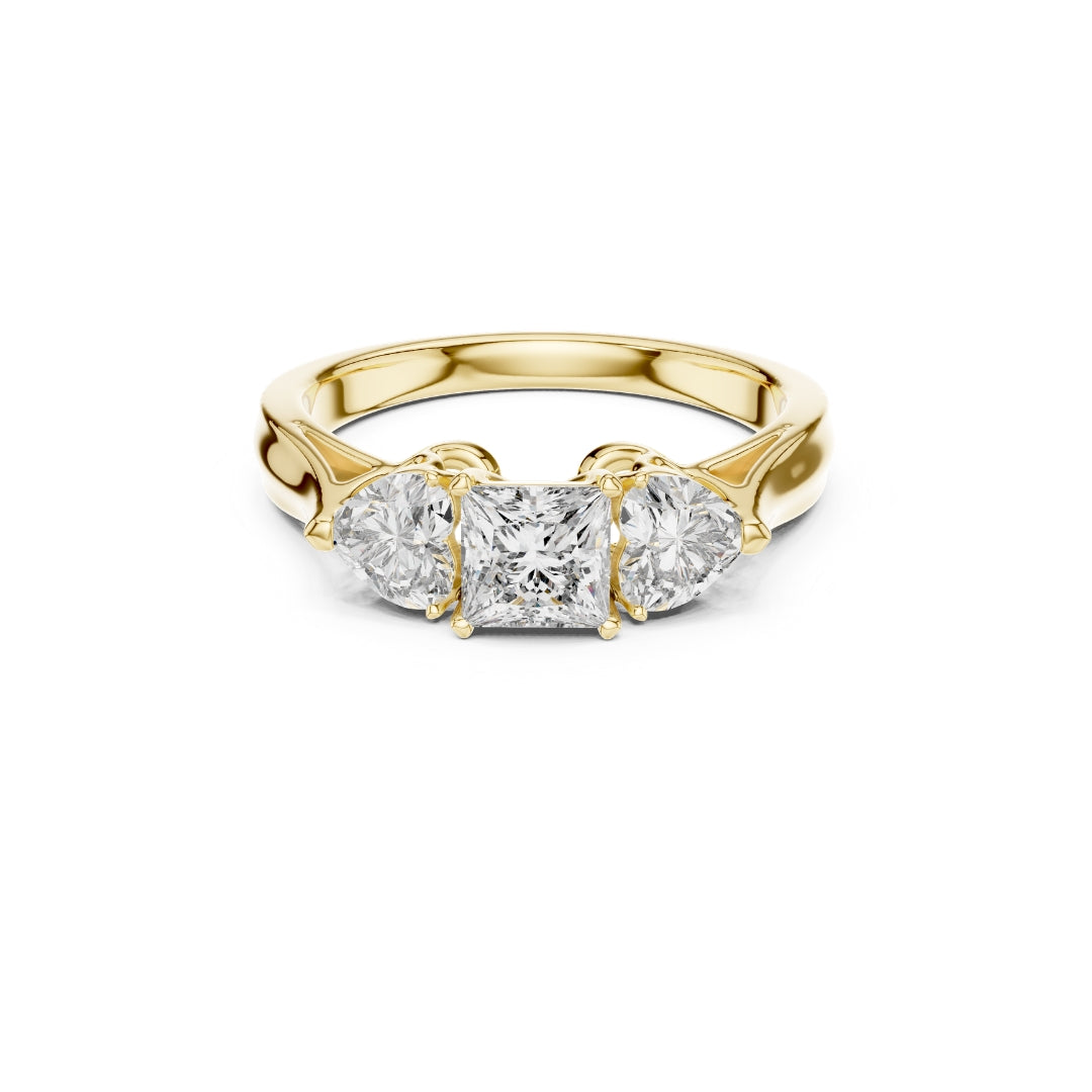Gold ring with three Moissanite diamonds on a white background