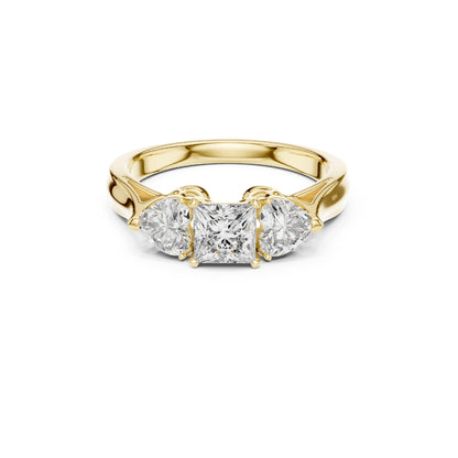 Gold ring with three Moissanite diamonds on a white background