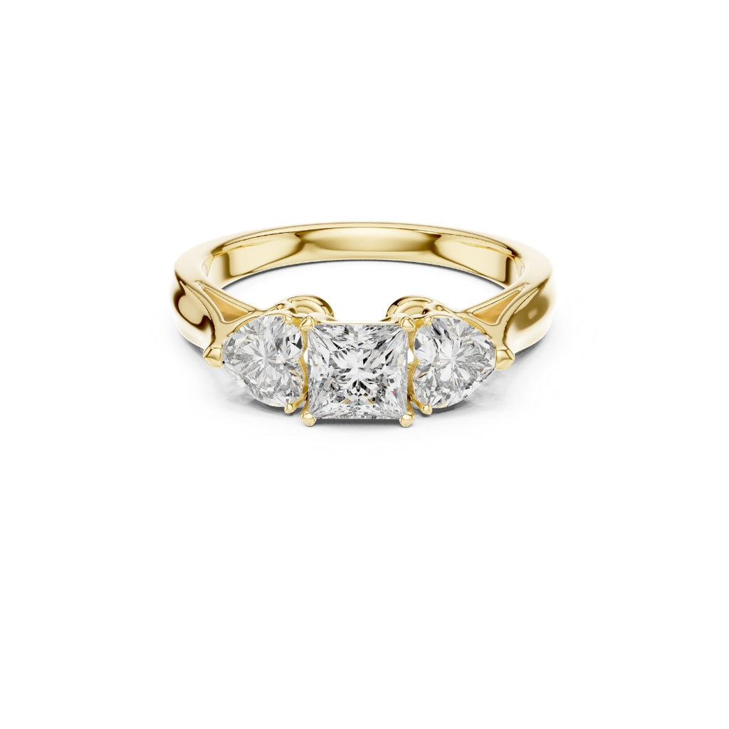 Gold ring with three Moissanite diamonds on a white background