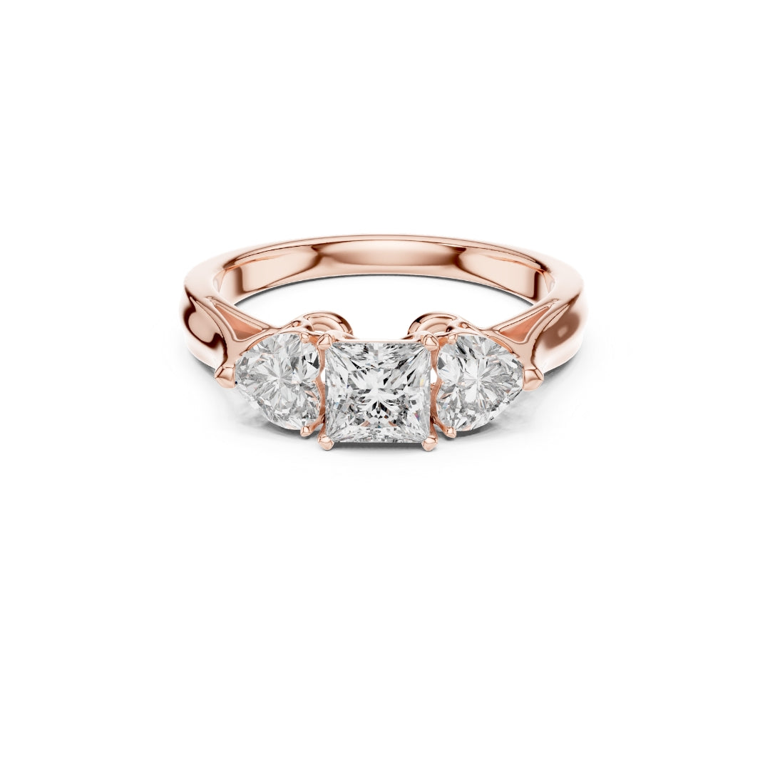 Rose gold ring with three Moissanite diamonds on a white background