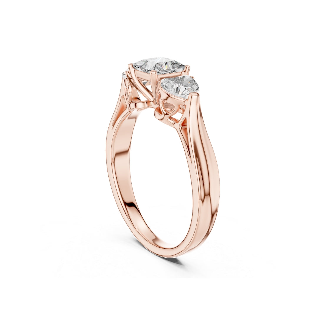 Rose gold ring with 3 Moissanite diamonds on a white background