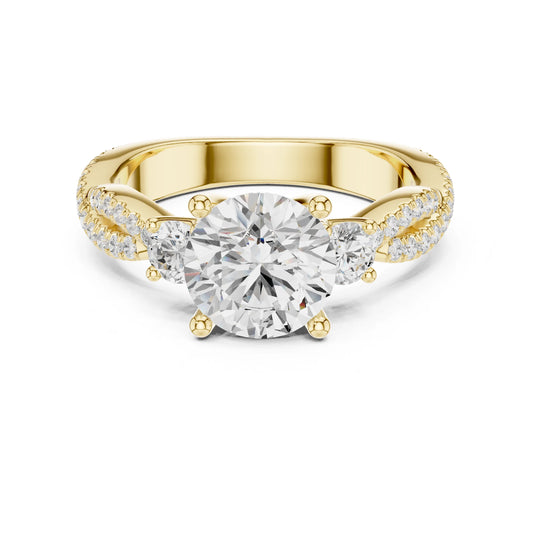 Gold ring with a large moissanite diamond and smaller diamonds on the band against a white background