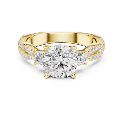 Gold ring with a large moissanite diamond and smaller diamonds on the band against a white background