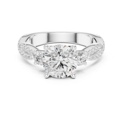 Silver ring with a large moissanite diamond and smaller diamonds on the band against a white background