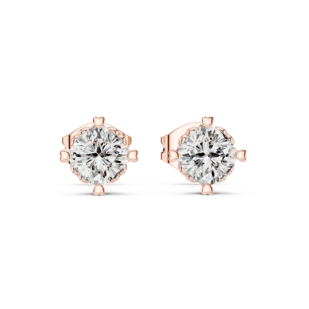 Rose gold stud earrings with clear moissanite gemstones on a white background