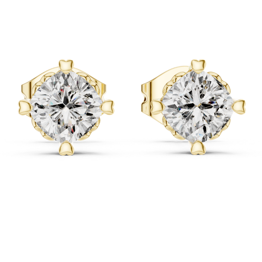 Gold stud earrings with clear moissanite gemstones on a white background
