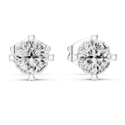 Pair of moissanite diamond stud earrings on a white background