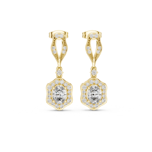 Gold earrings with clear moissanite  gemstones on a white background