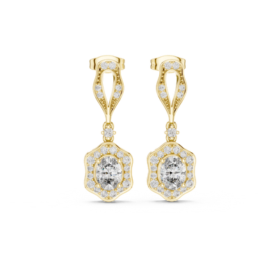 Gold earrings with clear moissanite  gemstones on a white background
