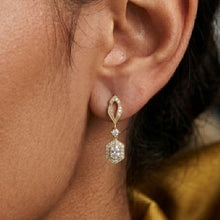 Load image into Gallery viewer, Close-up of a person wearing a gold and diamond earring.