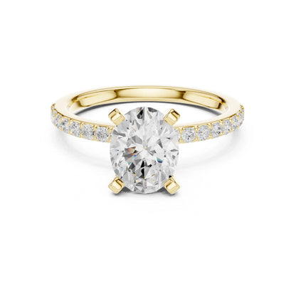 Gold ring with a large moissanite diamond and smaller diamonds on the band against a white background