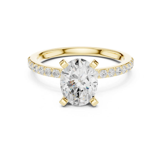 Gold ring with a large moissanite diamond and smaller diamonds on the band against a white background