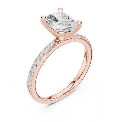 Rose gold ring with a large moissanite diamond and smaller diamonds on the band against a white background
